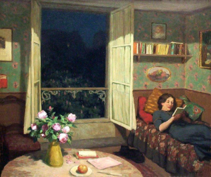 Tavik Simon Vilam reading books on a sofa